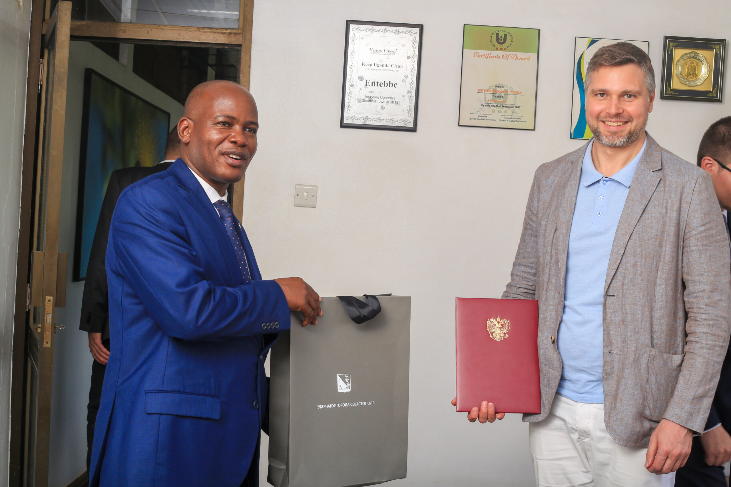 Prof. Jude exchanges pleasantries with Mr. Mansur shortly after signing the MoU.