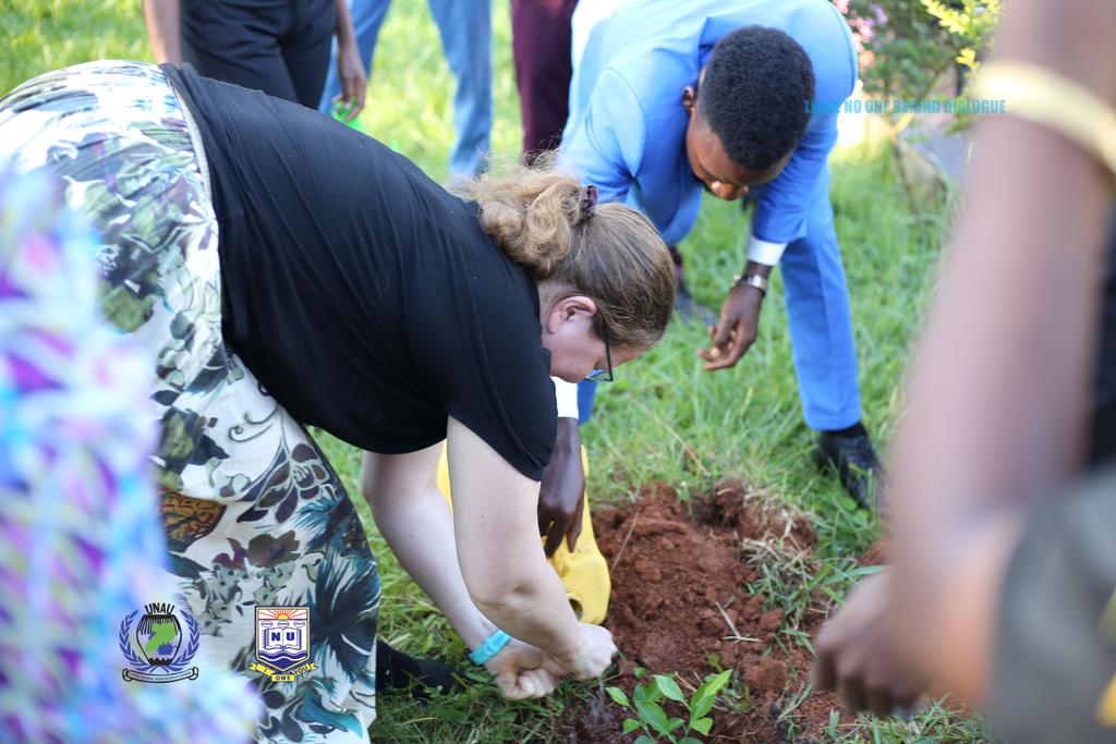 Jennifer Kauppila, planting a tree at Nkumba University