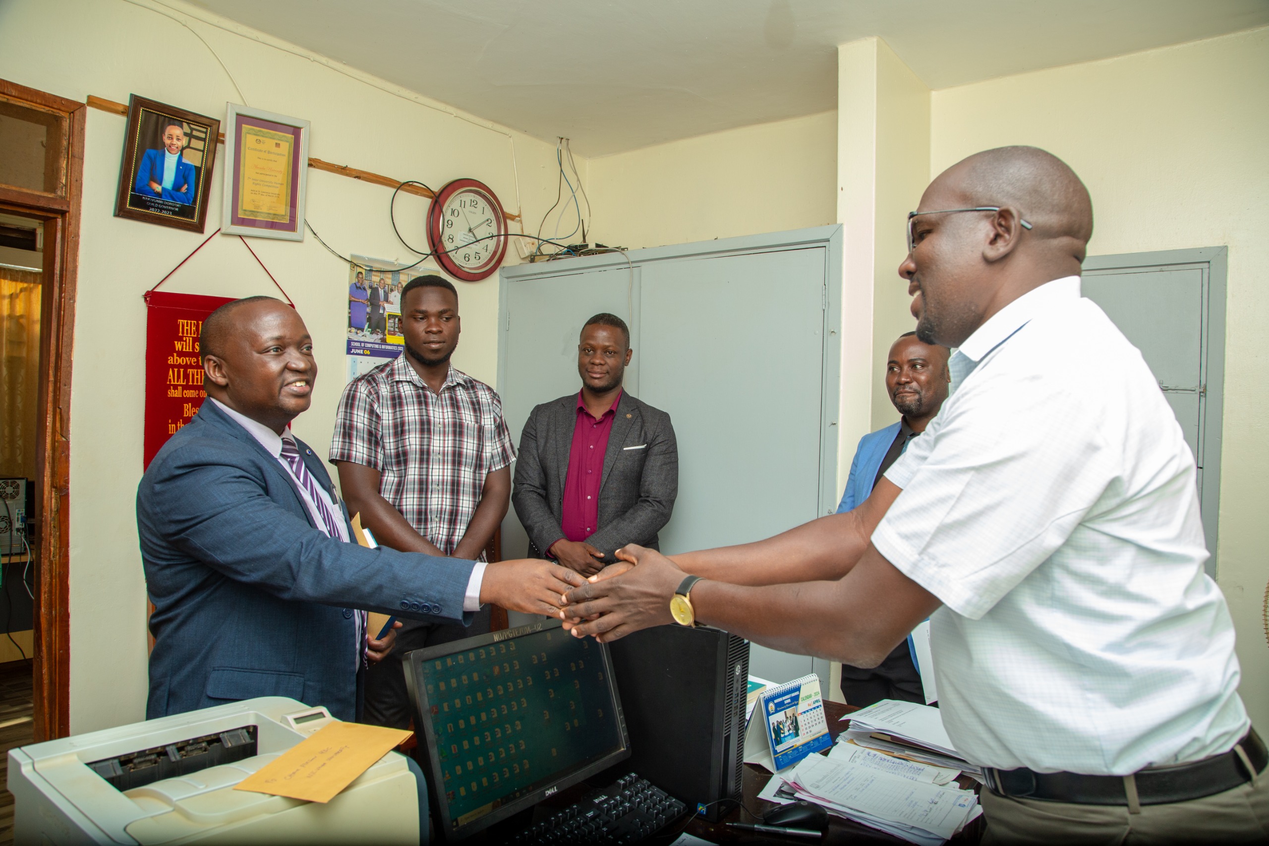 Dr. Mayanja being Welcomed by the Dean of Student.