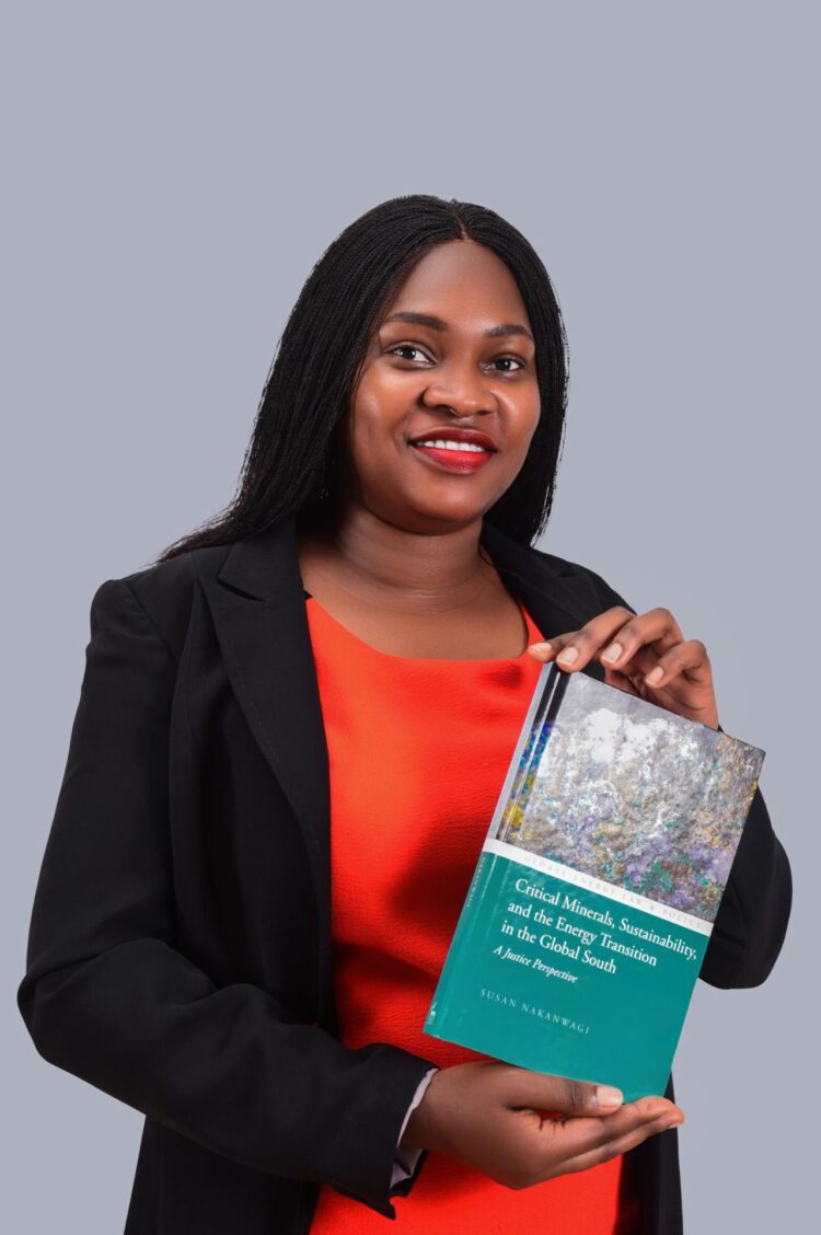 Dr. Susan Nakanwagi displays her book titled: Critical Minerals, Sustainability, and the Energy Transition in the Global South: A Justice Perspective.
