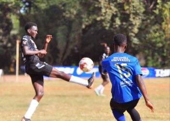 Nkumba's Mukasa Henry curling the ball pass Busitema defence