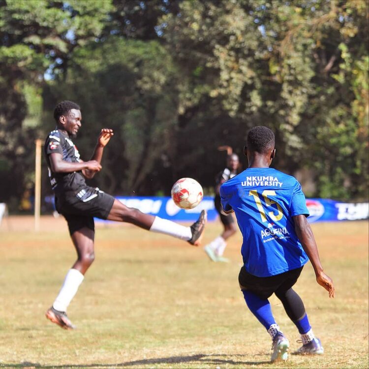 Nkumba's Mukasa Henry curling the ball pass Busitema defence