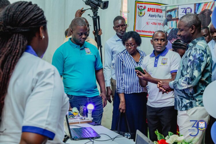 Deputy Speaker, Thomas Tayebwa while inspecting Nkumba University stall