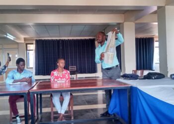 Luwemba while engaging students at the training.