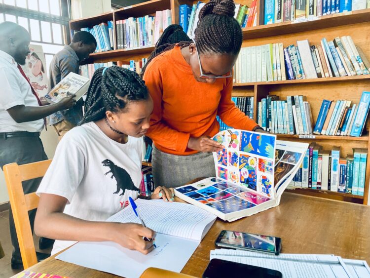Students making last minute grasp in the while in Mpanga Library