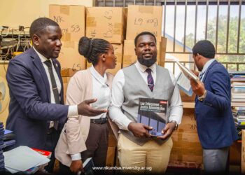 Law students checking out journals while at the Mpanga Library yesterday // Japheth Godwin Walakira
