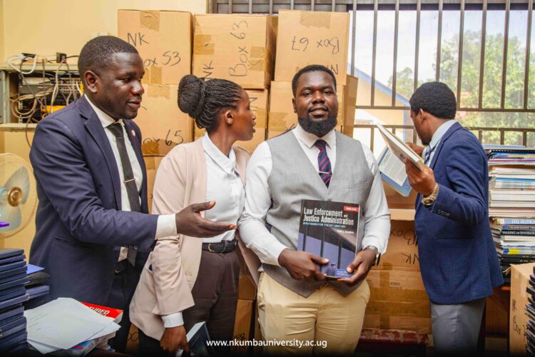 Law students checking out journals while at the Mpanga Library yesterday // Japheth Godwin Walakira