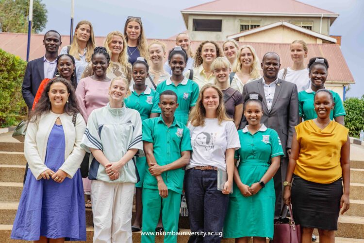 Nursing Students pose for a photo together with Vice Chancellor Prof. Jude Lubega in front of Mpanga Library