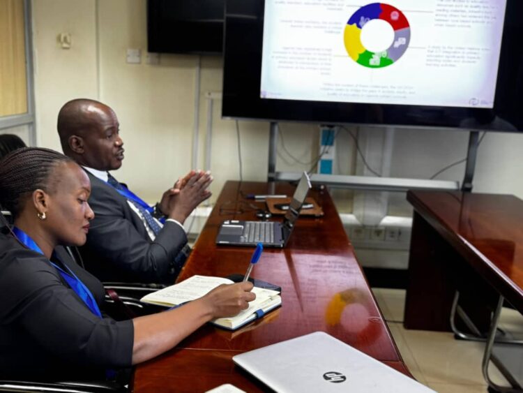Prof. Jude Lubega , Project Lead and Madam Mary Nantumbwe During an Inception Report Presentation at UCC