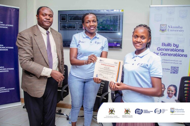 Madam Carolyn Vuni, Manager Technical Monitoring at UCC (M) Awarding a certificate of Participation to one of the Participants alongside Dr. Frank Pio Kiyingi (L).