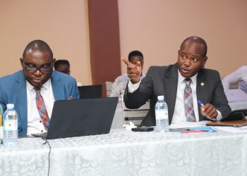Mr. John Mukiibi (L) and Prof. Jude Lubega (R) during the Exit Meeting