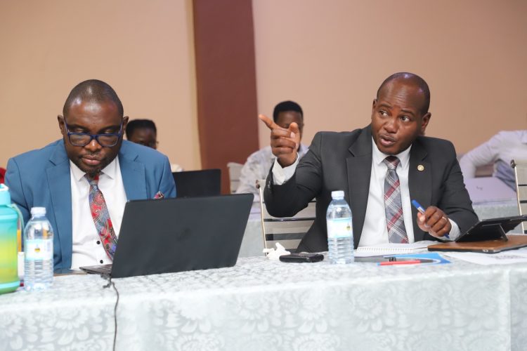 Mr. John Mukiibi (L) and Prof. Jude Lubega (R) during the Exit Meeting